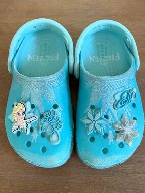 Kids Light Blue 'Frozen' Slip-On Crocs with jibbitz.